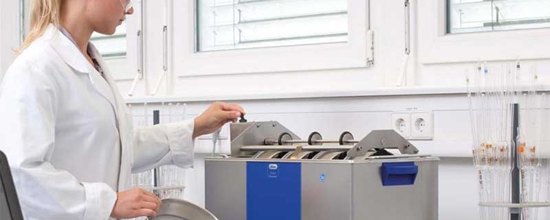 Woman Cleaning Sieves