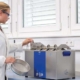 Woman Cleaning Sieves